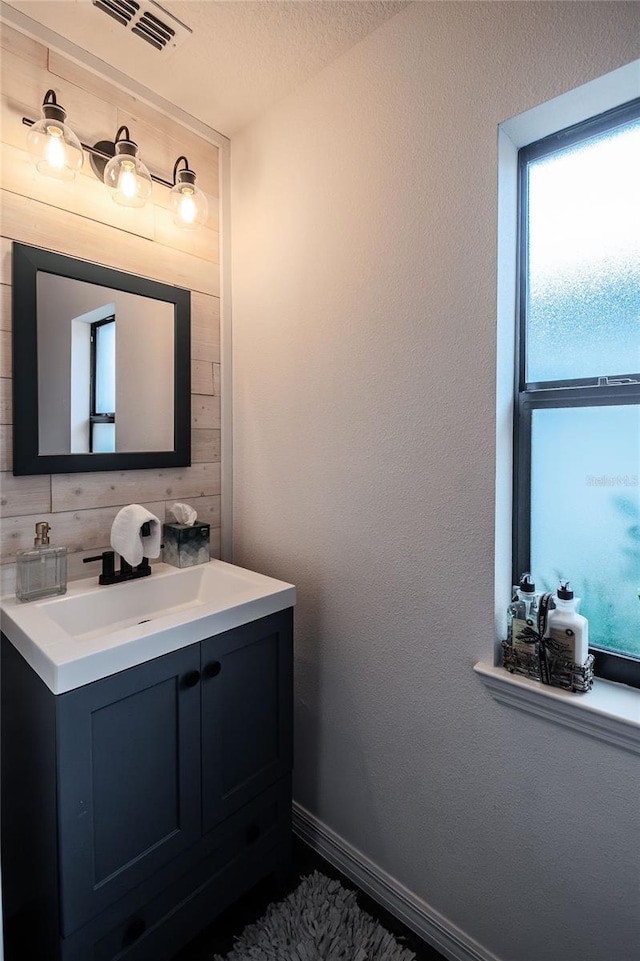 bathroom featuring backsplash and vanity