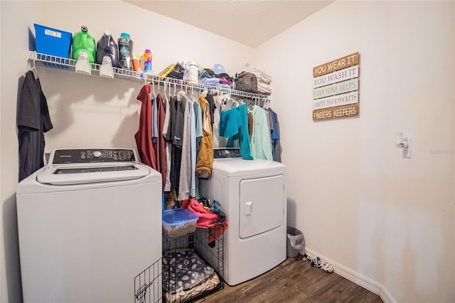 laundry room featuring hardwood / wood-style floors and washer and dryer