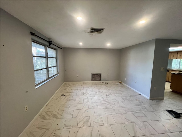 unfurnished room with plenty of natural light