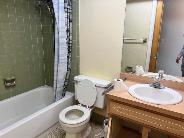 full bathroom with tile patterned floors, vanity, toilet, and shower / tub combo