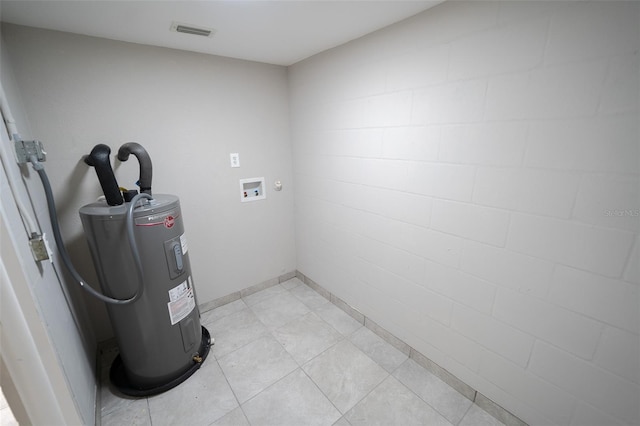 utility room featuring electric water heater