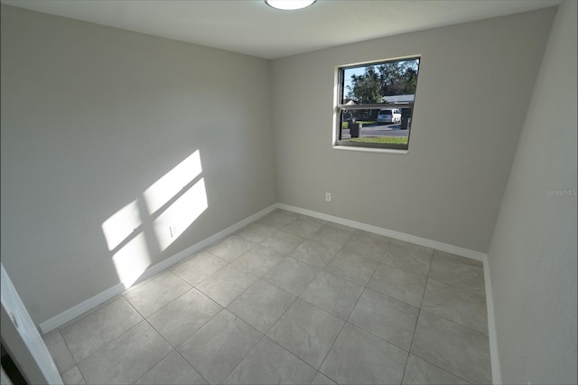 empty room featuring light tile patterned floors