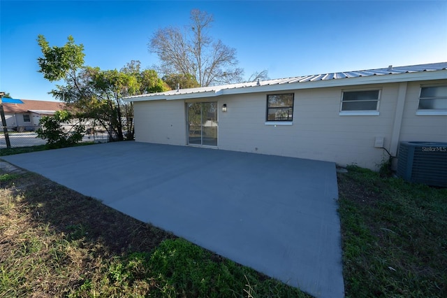 back of property featuring a patio area and central air condition unit