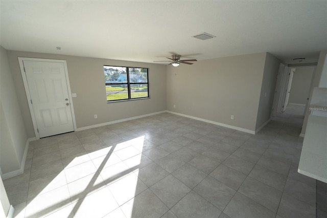 empty room featuring ceiling fan and light tile patterned floors