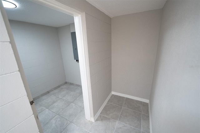 bathroom with tile patterned flooring and a textured ceiling