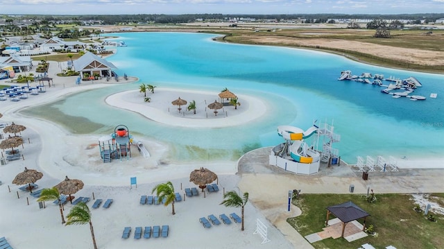 aerial view featuring a beach view and a water view