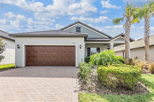 view of front of property with a garage