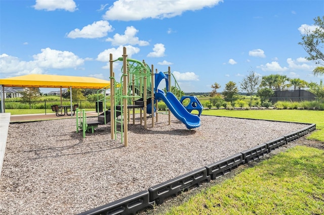 view of playground with a yard