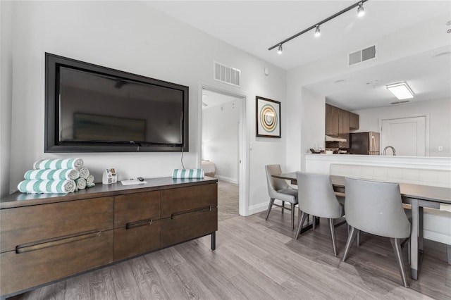 dining room with light hardwood / wood-style floors