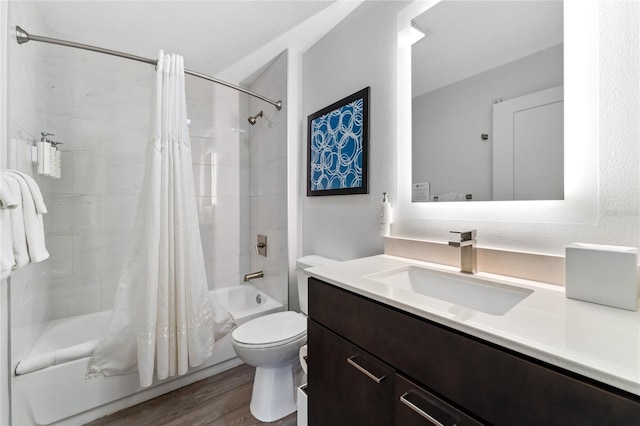 full bathroom featuring wood-type flooring, vanity, toilet, and shower / tub combo