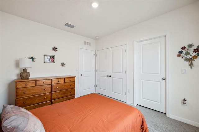 carpeted bedroom featuring a closet