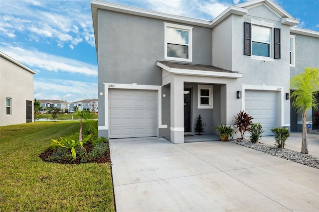 view of front of house featuring a front yard and a garage