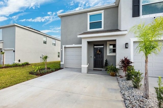 view of front of house with a garage and a front lawn