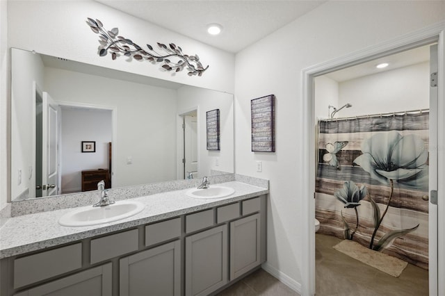 bathroom with vanity, a shower with shower curtain, and toilet