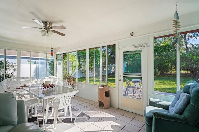 sunroom with ceiling fan and a wealth of natural light