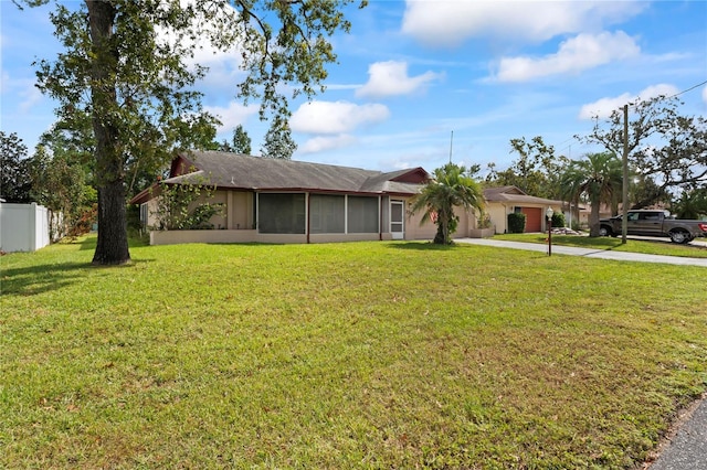 ranch-style house with a sunroom and a front lawn