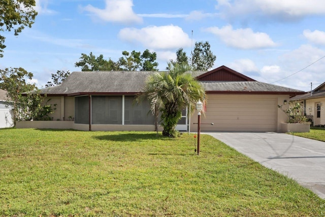 ranch-style house with a sunroom, a front yard, and a garage