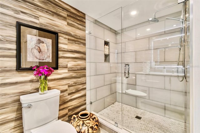 bathroom featuring toilet and walk in shower