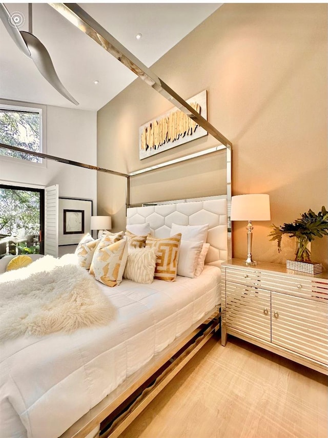 bedroom with wood-type flooring and ceiling fan