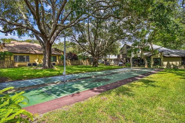 view of home's community with a yard