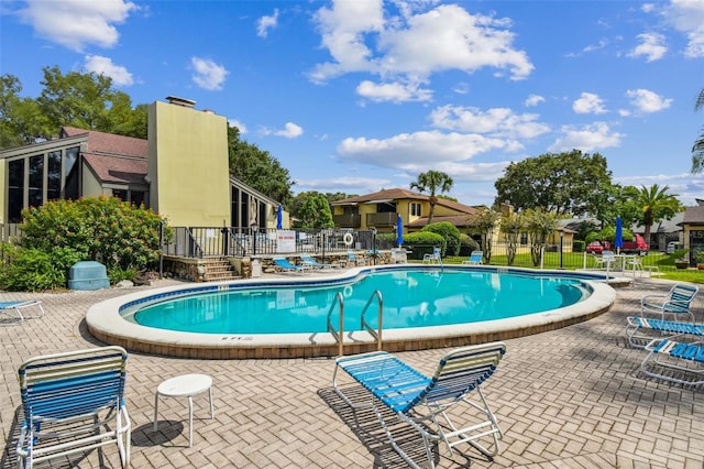 view of swimming pool with a patio