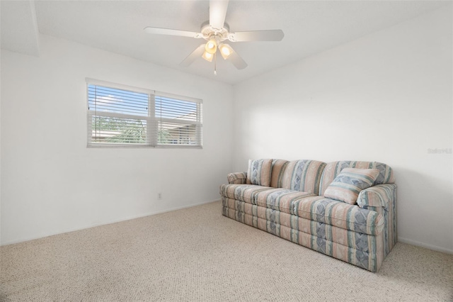 living area featuring carpet flooring and ceiling fan