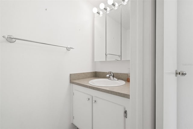 bathroom featuring a textured ceiling and vanity