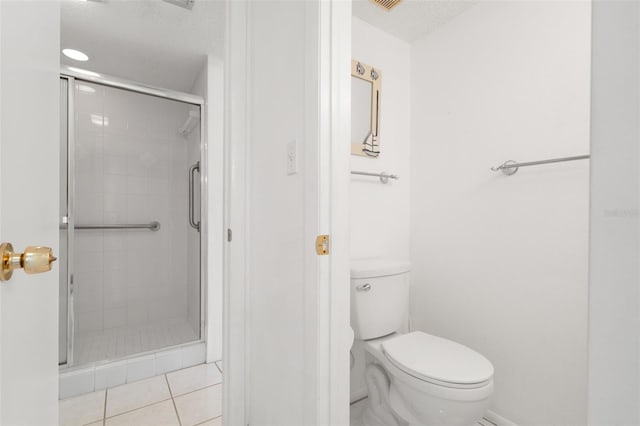 bathroom featuring walk in shower, tile patterned flooring, a textured ceiling, and toilet