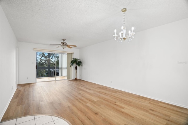 unfurnished room with light wood-type flooring, baseboards, a textured ceiling, and ceiling fan with notable chandelier