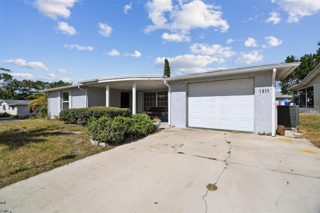 7511 Tyson Dr, Port Richey, FL 34668 - ranch-style house featuring an attached garage, driveway, and stucco siding