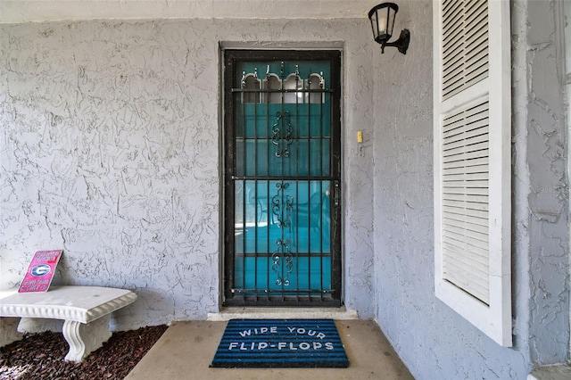 7511 Tyson Dr, Port Richey, FL 34668 - property entrance with stucco siding