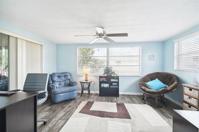 7511 Tyson Dr, Port Richey, FL 34668 - living area with plenty of natural light, wood finished floors, and a ceiling fan