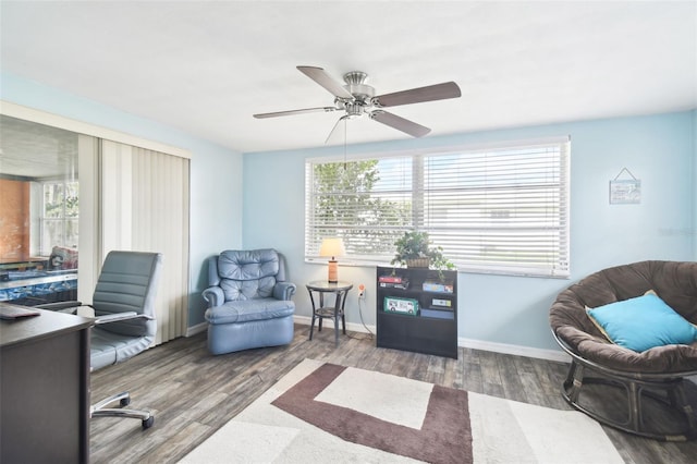 home office featuring wood-type flooring and ceiling fan