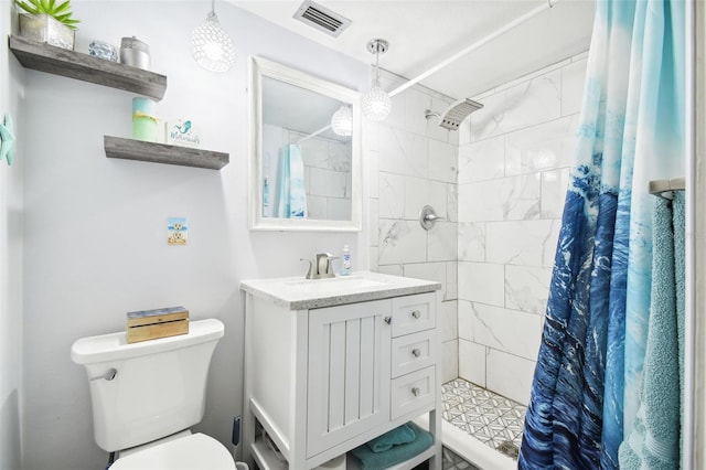 7511 Tyson Dr, Port Richey, FL 34668 - bathroom featuring a shower stall, toilet, and vanity