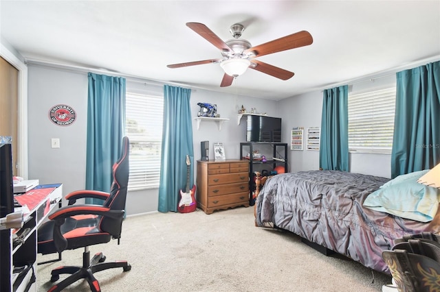 carpeted bedroom with ceiling fan