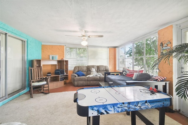 7511 Tyson Dr, Port Richey, FL 34668 - playroom featuring healthy amount of natural light, ceiling fan, and a textured ceiling