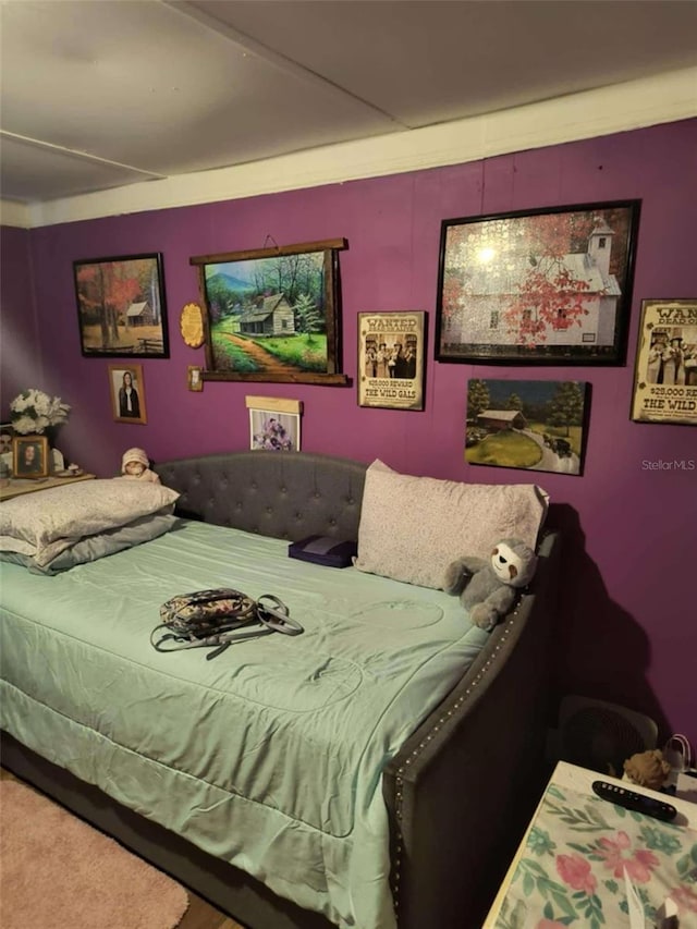 bedroom featuring crown molding