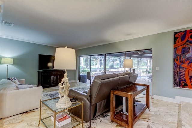 living room featuring crown molding