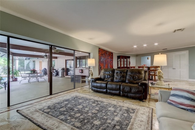 living room featuring crown molding