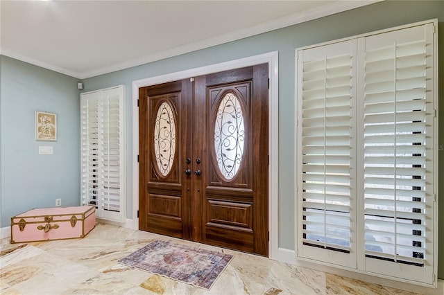 foyer featuring crown molding