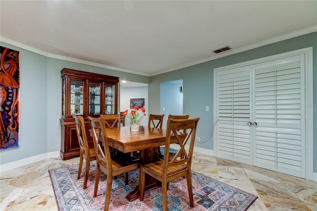 dining room with ornamental molding