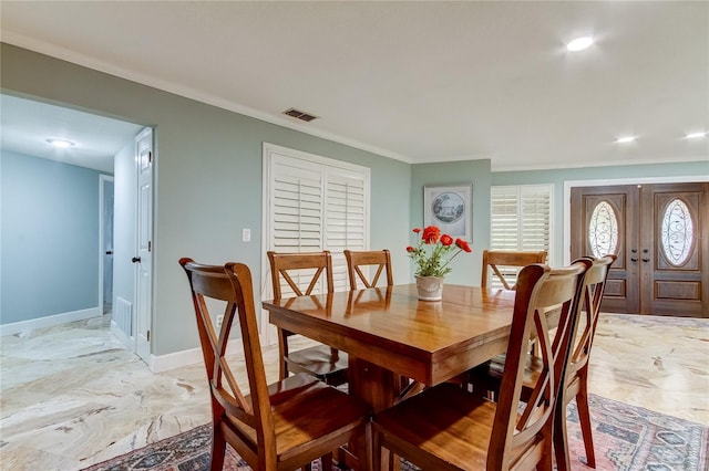 dining room with crown molding