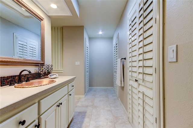 bathroom with vanity and tile patterned flooring