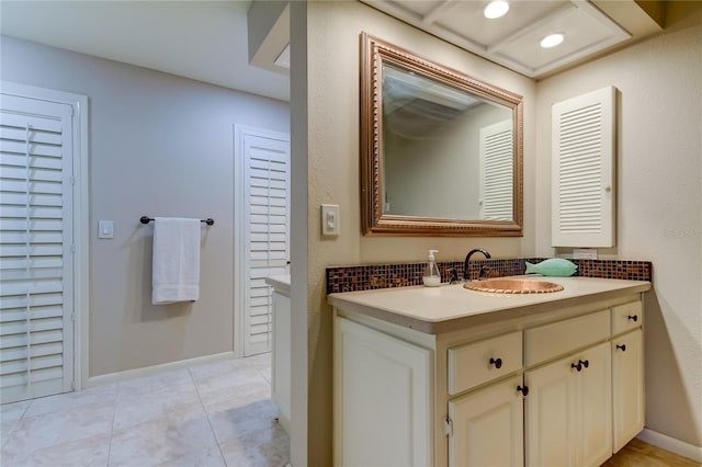 bathroom with vanity and tile patterned flooring