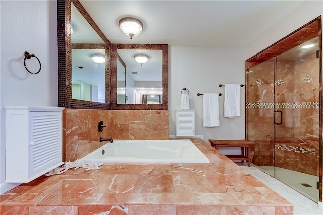 bathroom with separate shower and tub