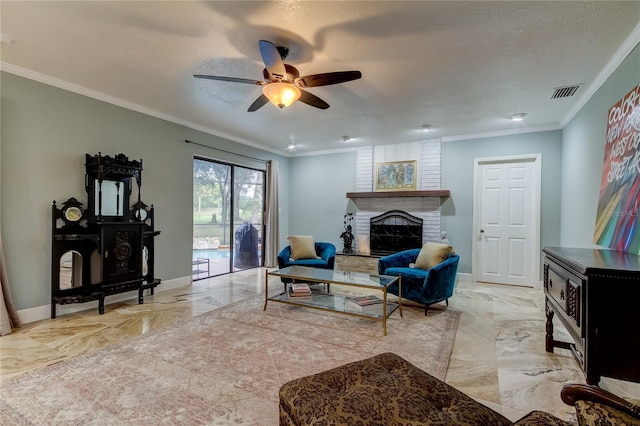 living room featuring ornamental molding, a fireplace, a textured ceiling, and ceiling fan