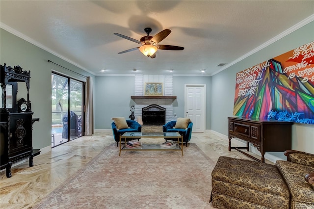 living room featuring ceiling fan, a textured ceiling, ornamental molding, and a brick fireplace