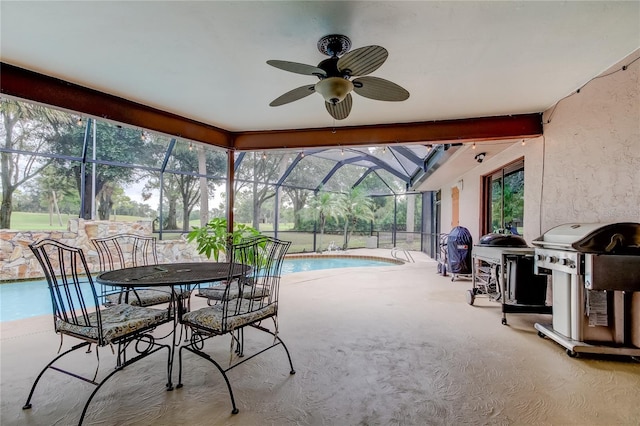 sunroom with a swimming pool and ceiling fan