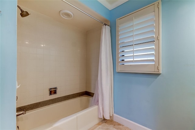 bathroom with shower / tub combo