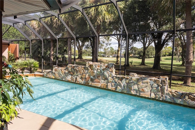 view of swimming pool featuring glass enclosure and pool water feature